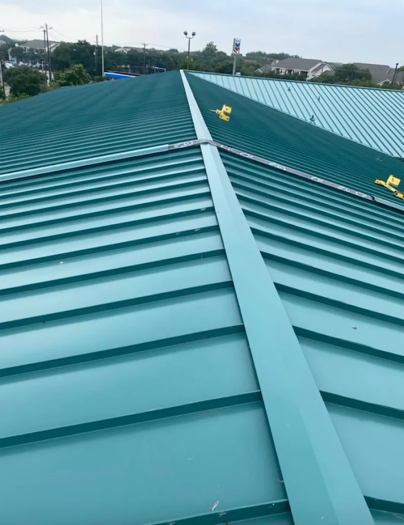Green commercial metal roof ridge and valley for Metal Roof Repair in St. Robert